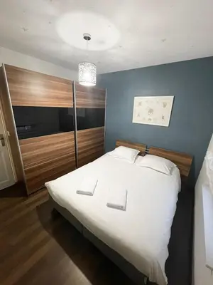 Un ou plusieurs lits dans un hébergement de l'établissement Bale 23 Magnifique Logement 6 Pers Parking Prive