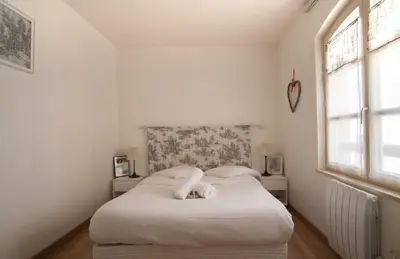 Un ou plusieurs lits dans un hébergement de l'établissement Bel appartement au centre de Colmar