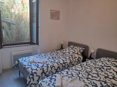 Un ou plusieurs lits dans un hébergement de l'établissement Le calme à 2 pas du centre - F2 - 4 couchages