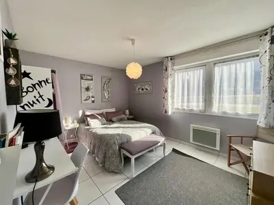 Un ou plusieurs lits dans un hébergement de l'établissement Le Cosy Blanchepierre, bel appartement classé 3 étoiles
