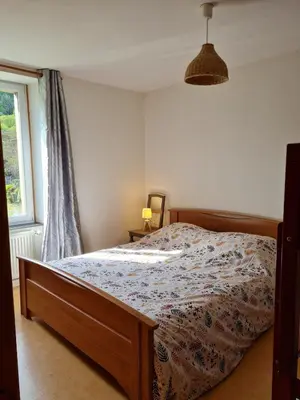 Un ou plusieurs lits dans un hébergement de l'établissement Joli appartement 4 personnes à la campagne