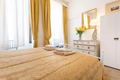 Un ou plusieurs lits dans un hébergement de l'établissement Apartments Center Colmar