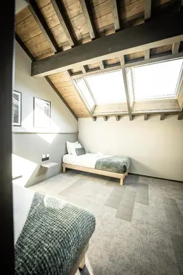Un ou plusieurs lits dans un hébergement de l'établissement Hôtel L'Echappée Vosgienne - Nature - Récupération - Sport - 300m du lac