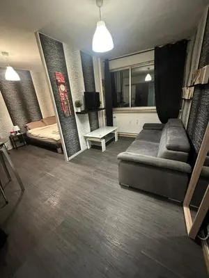 Coin salon dans l'établissement Appartement Centre ville