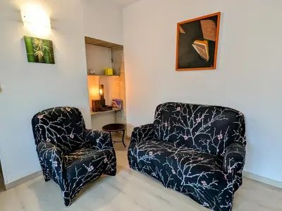 Coin salon dans l'établissement Gîte paisible au pied du Bassin de Champagney, animaux acceptés - FR-1-583-372
