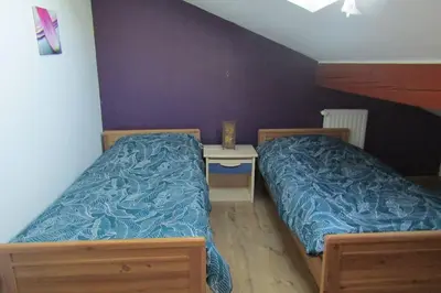 Un ou plusieurs lits dans un hébergement de l'établissement Gîte Les Fremi'Zh