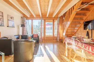 Coin salon dans l'établissement Le Refuge des Cerfs - Duplex vue montagne