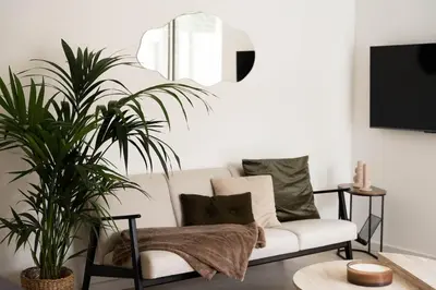 Télévision ou salle de divertissement dans l'établissement La Villa Les Berges de l 'Ill