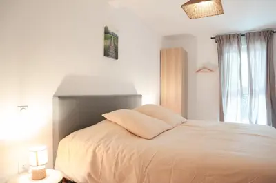 Un ou plusieurs lits dans un hébergement de l'établissement Duplex Harmonie proche frontière