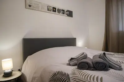 Un ou plusieurs lits dans un hébergement de l'établissement Plaisir partagé Apartment