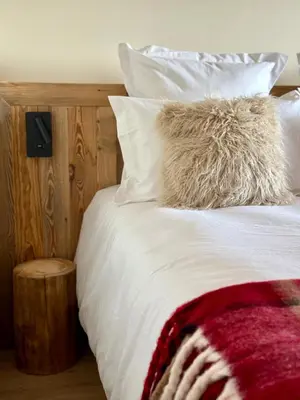 Un ou plusieurs lits dans un hébergement de l'établissement Chalet Cimebleu SPA & Sauna
