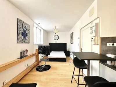Coin salon dans l'établissement Appartement élégant et fonctionnel