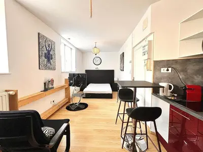 Cuisine ou kitchenette dans l'établissement Appartement élégant et fonctionnel