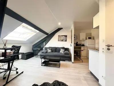 Cuisine ou kitchenette dans l'établissement Appartement moderne et central