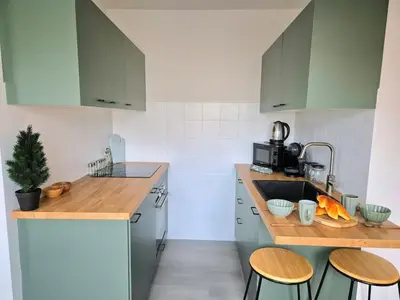 Cuisine ou kitchenette dans l'établissement Le Repaire de la Marmotte