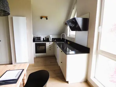 Cuisine ou kitchenette dans l'établissement Entre Vignes et Verger