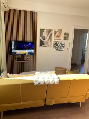 Télévision ou salle de divertissement dans l'établissement Le Jardin Secret F3 Elégance comfort