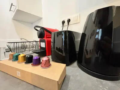 Cuisine ou kitchenette dans l'établissement L'Atelier Urbain Apartment