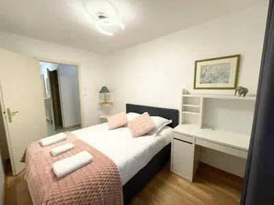 Un ou plusieurs lits dans un hébergement de l'établissement Le Fleur Magnifique Appartement Saint-Louis