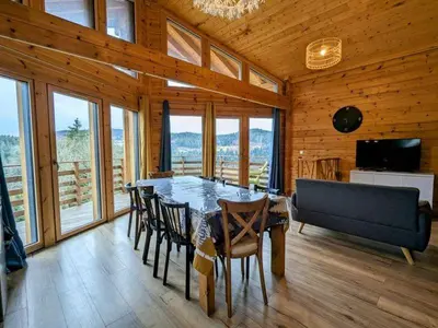 Télévision ou salle de divertissement dans l'établissement Chalet L 'instant Géromois