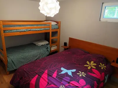 Un ou plusieurs lits dans un hébergement de l'établissement Chalet L 'instant Géromois