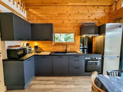 Cuisine ou kitchenette dans l'établissement Chalet L 'instant Géromois
