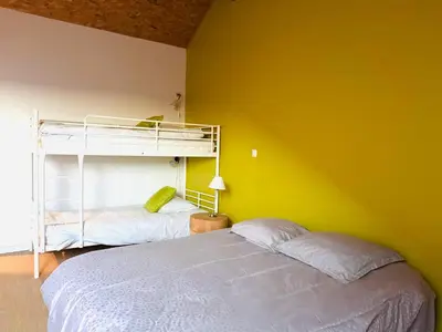 Un ou plusieurs lits dans un hébergement de l'établissement My Cozy Home