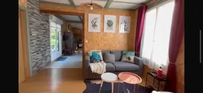 Un ou plusieurs lits dans un hébergement de l'établissement chalet cosy au calme