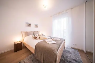 Un ou plusieurs lits dans un hébergement de l'établissement Le Bâle 92A Appartement 6 Pers Parking Privé