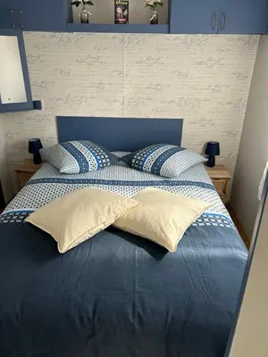 Un ou plusieurs lits dans un hébergement de l'établissement Chez Dom & Oli camping GINA PARK