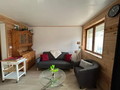 Coin salon dans l'établissement Logis proche Gerardmer avec spa