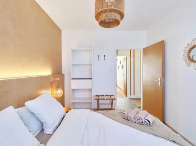 Un ou plusieurs lits dans un hébergement de l'établissement 2BR Apartment near Colmar Centre - Boho Style, Hidden Room, Free Parking
