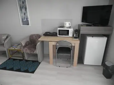 Cuisine ou kitchenette dans l'établissement Grande chambre à louer