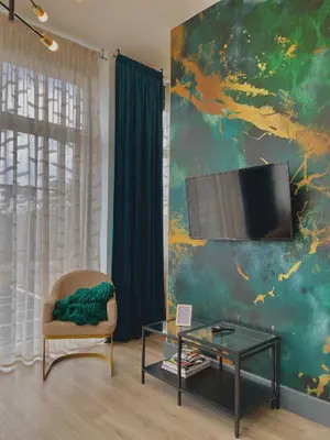 Télévision ou salle de divertissement dans l'établissement Logement Émeraude