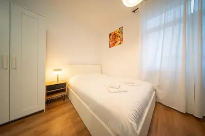 Un ou plusieurs lits dans un hébergement de l'établissement Frontiere Suites 2 Saint-Louis Proche Bale