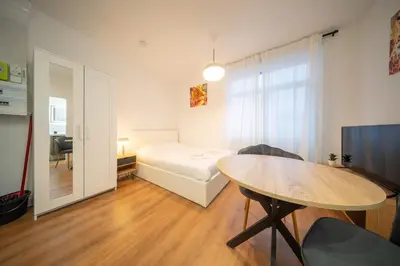 Un ou plusieurs lits dans un hébergement de l'établissement Frontiere Suites 2 Saint-Louis Proche Bale