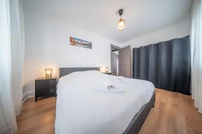Un ou plusieurs lits dans un hébergement de l'établissement Frontiere Suites 7 Saint-Louis Proche Bale