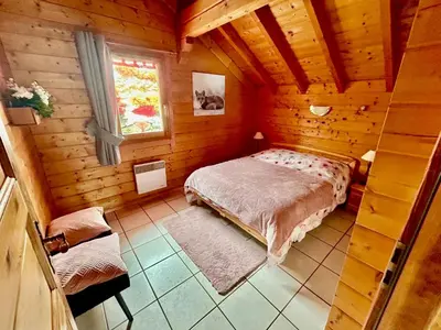 Un ou plusieurs lits dans un hébergement de l'établissement Chalet Le Roncing