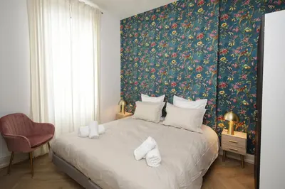 Un ou plusieurs lits dans un hébergement de l'établissement LE LYNX HAUSSMANIEN appartement tout confort, climatisé avec parking privé, à deux pas du centre