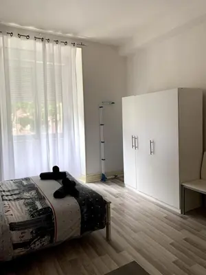 Un ou plusieurs lits dans un hébergement de l'établissement Grand appartement proche centre et tram