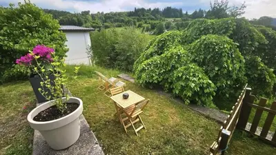 Jardin de l'établissement f2 VUE INCROYABLe sur lac avec jardin avec balnéo et 400m centre