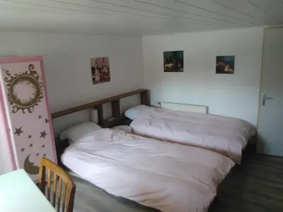 Un ou plusieurs lits dans un hébergement de l'établissement Le Gîte du Facteur d 'Orgues