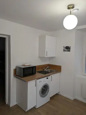 Cuisine ou kitchenette dans l'établissement La planque du 1er