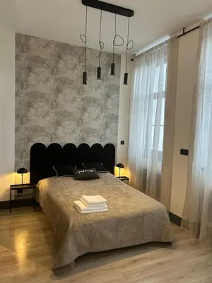 Un ou plusieurs lits dans un hébergement de l'établissement Studio Marie-Louise