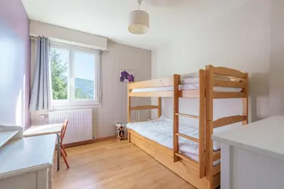 Un ou plusieurs lits dans un hébergement de l'établissement L'Echo Bleu - Vue Montagne