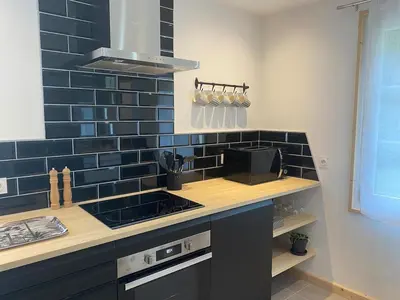 Cuisine ou kitchenette dans l'établissement Maison de ville - Parking privé