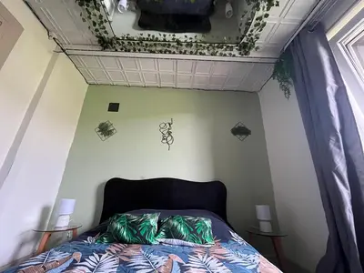 Un ou plusieurs lits dans un hébergement de l'établissement L'appart avec jardin