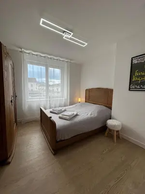 Un ou plusieurs lits dans un hébergement de l'établissement La Jonquille, Appartement Centre Ville de Gérardmer, linge et ménage inclus