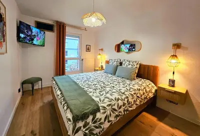 Un ou plusieurs lits dans un hébergement de l'établissement Gîte Forestier - T2 Cosy avec Terrasse & 2 Parkings privatifs -Centre ville