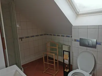 Télévision ou salle de divertissement dans l'établissement Le Bretzel